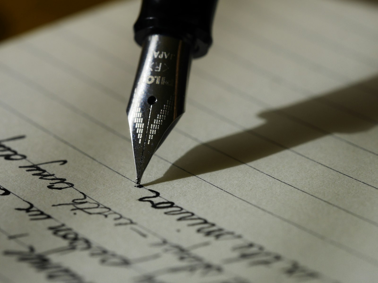 Notebook and pen on a table for reflective writing